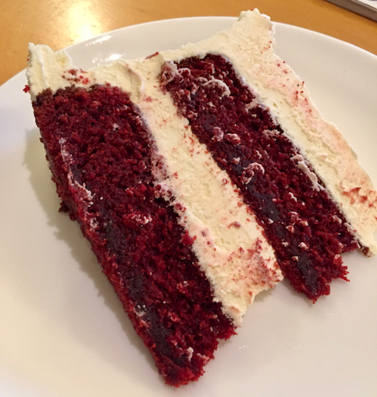 A slice of red velvet cake